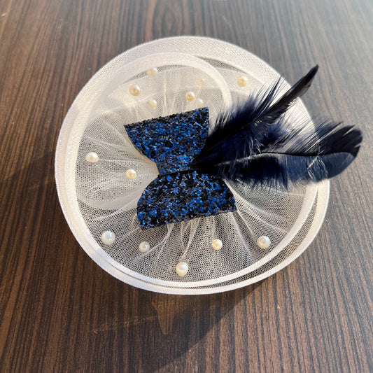 Twisted White Fascinator with Blue sparkle Bow and Feather